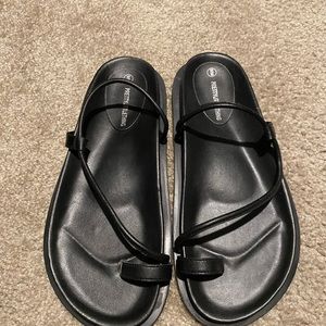 Flat black sandals